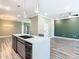 Kitchen island features stainless steel appliances and plenty of room for seating at 2000 Greenbriar Ter, Davenport, FL 33837