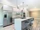 Contemporary kitchen with an island, stainless steel appliances, and plenty of counter space at 2000 Greenbriar Ter, Davenport, FL 33837