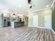 An open layout showcasing modern design with sleek gray and white cabinets and stainless appliances at 2000 Greenbriar Ter, Davenport, FL 33837