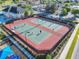 Aerial view of community tennis and pickleball courts, a great amenity for residents at 2000 Greenbriar Ter, Davenport, FL 33837