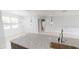 Bright kitchen with granite counters, stainless steel sink, and modern lighting at 212 Grouper Ct, Poinciana, FL 34759