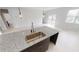 Modern kitchen has granite counters and stainless steel sink at 212 Grouper Ct, Poinciana, FL 34759