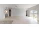 Bright living room with wood-style flooring, modern lighting, and sliding glass doors at 212 Grouper Ct, Poinciana, FL 34759
