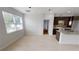 Bright living room features lots of natural light and wood-style flooring at 212 Grouper Ct, Poinciana, FL 34759