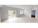 Spacious living room with access to the backyard through sliding glass doors at 212 Grouper Ct, Poinciana, FL 34759