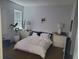 Bright bedroom with a neutral color palette and large window at 212 Grouper Ct, Poinciana, FL 34759