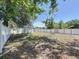 The expansive backyard features a sturdy fence, potential for landscaping, and a shed at 2409 E Magnolia St, Lakeland, FL 33801