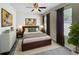 Stylish bedroom features luxury vinyl plank flooring, a ceiling fan, and abundant natural light at 2409 E Magnolia St, Lakeland, FL 33801