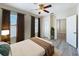 Relaxing bedroom features updated luxury vinyl plank flooring, fresh gray paint, and a ceiling fan at 2409 E Magnolia St, Lakeland, FL 33801