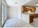 Bright dining area with tile floors and glass doors that provide access to outdoor spaces at 2409 E Magnolia St, Lakeland, FL 33801