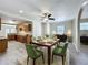 Open dining area with hardwood floors, modern lighting, and seamless flow to the kitchen at 2409 E Magnolia St, Lakeland, FL 33801