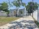 Attractive single Gathering home with brick paved driveway and well maintained lawn at 2409 E Magnolia St, Lakeland, FL 33801