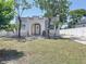 Charming single Gathering home with a well-maintained lawn and arched entryway at 2409 E Magnolia St, Lakeland, FL 33801