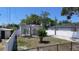 Home with an arched entryway, red tile roof, and a neatly landscaped front yard at 2409 E Magnolia St, Lakeland, FL 33801