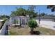 Home with an arched entryway, red tile roof, and a neatly landscaped front yard at 2409 E Magnolia St, Lakeland, FL 33801