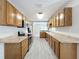 Functional galley kitchen with ample cabinet space and modern appliances at 2409 E Magnolia St, Lakeland, FL 33801