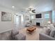 Spacious living room featuring modern decor, fireplace, and an open layout at 2409 E Magnolia St, Lakeland, FL 33801