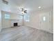 Bright living room with a fireplace and hardwood floors, perfect for relaxation and entertaining at 2409 E Magnolia St, Lakeland, FL 33801