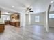 Open living area with hardwood floors, modern lighting, and seamless flow to the kitchen at 2409 E Magnolia St, Lakeland, FL 33801