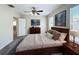 Well-appointed main bedroom featuring a large bed, wood furniture, and soft lighting for a relaxing ambiance at 2409 E Magnolia St, Lakeland, FL 33801