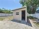 The backyard features a shed with a concrete foundation and a bright, inviting door at 2409 E Magnolia St, Lakeland, FL 33801