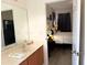 Bathroom that leads into a bedroom with a big bed and modern decor at 2514 Dharma Cir, Kissimmee, FL 34746