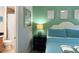 Cozy bedroom showcasing an en-suite bathroom and calming green accents at 2514 Dharma Cir, Kissimmee, FL 34746
