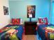 Vibrant bedroom featuring superhero themed decor and comfortable twin beds at 2514 Dharma Cir, Kissimmee, FL 34746