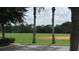 View of the community baseball field with trees and sky in background at 2673 Rainbow Springs Ln, Orlando, FL 32828
