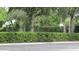 Community basketball court area featuring hoops, parking area and green landscape at 2673 Rainbow Springs Ln, Orlando, FL 32828