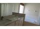 Bathroom showcasing a soaking tub and a double sink vanity at 2673 Rainbow Springs Ln, Orlando, FL 32828