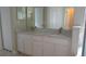 Bathroom highlighting a double-sink vanity with granite countertop at 2673 Rainbow Springs Ln, Orlando, FL 32828