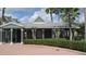 Community clubhouse with covered seating area and well-kept landscaping at 2673 Rainbow Springs Ln, Orlando, FL 32828
