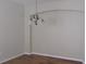 Empty Dining room with chandelier and hardwood floors at 2673 Rainbow Springs Ln, Orlando, FL 32828
