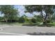 Well-maintained home featuring lush landscaping and mature trees at 2673 Rainbow Springs Ln, Orlando, FL 32828