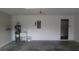 Spacious garage featuring a water heater, sink, and utility closet for extra storage at 2673 Rainbow Springs Ln, Orlando, FL 32828