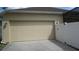 Attached two-car garage providing convenient parking and storage space for homeowners at 2673 Rainbow Springs Ln, Orlando, FL 32828