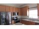 Well-appointed kitchen with granite countertops, stainless steel appliances, and ample cabinet space at 2673 Rainbow Springs Ln, Orlando, FL 32828