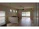 Bright living room offers a cozy seating area with modern flooring and sliding door to patio at 2673 Rainbow Springs Ln, Orlando, FL 32828