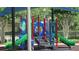 Community playground with climbing structure and slides for children at 2673 Rainbow Springs Ln, Orlando, FL 32828
