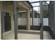 View of the outdoor screened porch area showcasing the enclosed patio for relaxation and privacy at 2673 Rainbow Springs Ln, Orlando, FL 32828