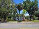 Charming property showcasing home with mature trees and a well-maintained lawn at 2704 Sample St, Kissimmee, FL 34744