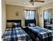 Shared bedroom with matching beds, linens, and an open closet with a mirror at 2734 Rio Grande Trl # 2734, Kissimmee, FL 34741