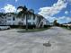 Exterior street view of the property, with palm tree in the front and ample parking space at 2734 Rio Grande Trl # 2734, Kissimmee, FL 34741