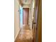 Hallway featuring neutral paint, tile flooring and multiple doors at 2779 Theresa Dr, Kissimmee, FL 34744
