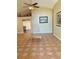 Bright living room with tile floors and neutral walls, with views of a secondary room at 2779 Theresa Dr, Kissimmee, FL 34744