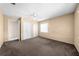 Bedroom featuring carpet floors, ceiling fan, closet space and a window to let in natural light at 2947 Larson St, Kissimmee, FL 34741