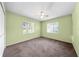 Well-lit bedroom featuring two windows and a ceiling fan, perfect for relaxation at 2947 Larson St, Kissimmee, FL 34741