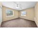 Bright bedroom with carpet floors and two windows at 2947 Larson St, Kissimmee, FL 34741