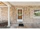 Exterior view of the front door shows stone facade and large window at 2947 Larson St, Kissimmee, FL 34741